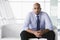 Businessman sitting on sofa in lobby