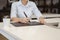 Businessman sitting to working at office desk have a coffee cup beside for efficient work  problems and concepts.