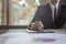 Businessman sitting to working at office desk have a coffee cup beside for efficient work  problems and concepts.