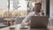 Businessman sitting and working in a cafe. Man using computer devices. Business and entrepreneurship.