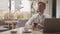 Businessman sitting and working in a cafe. Man using computer devices. Business and entrepreneurship.