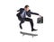 A businessman with skateboard jumping