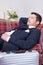 Businessman sleeps on sofa