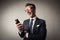 Businessman with a smartphone laughing