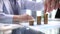 Businessman stacking coins on table, business growth concept. Hand puts coin to stack.