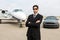 Businessman Standing In Front Of Car And Private