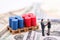 Businessman standing in front of drums oil and shake hand with team