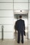 Businessman Standing In Front View Elevator