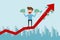 Businessman standing on growth graph and holding money. Success concept.