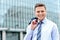 Businessman standing outside modern building