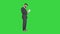 Businessman standing and reading docs seriously on a Green Screen, Chroma Key.