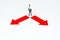 Businessman standing with red arrow to choosing correct direction