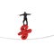 Businessman standing on red percentage sign balancing tightrope