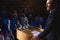 Businessman standing on a stage of auditorium for presentation