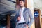 Businessman standing in underground parking