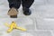 Businessman stepping on banana skin, work accident, copy space