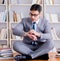 Businessman student in lotus position concentrating meditating