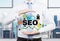 Businessman suggested effective \'SEO\' optimisation approach.