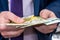 Businessman in suit counting euro banknotes, closeup