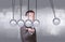 Businessman in suit hold Newtons cradle