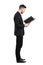 Businessman in suit reading document or contract side view