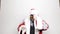 Businessman in a suit of Santa Claus wiping glasses raised hand to his eyes and looks into the distance