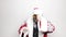 Businessman in a suit of Santa Claus wiping glasses raised hand to his eyes and looks into the distance