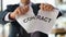 Businessman in suit tearing paper document contract at work in office closeup