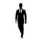 Businessman in suit walking forward, abstract vector silhouette, ink drawing. Isolated character