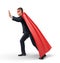 A businessman in a superhero red cape and an eye mask pushing on an invisible object in side view.