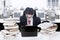 Businessman surrounded with books and computer