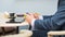 Businessman with tablet and smartphone during breakfast.