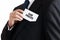 Businessman takes out a business card from his pocket with the message our prices. Business service price offer