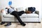 Businessman taking break laying on couch