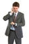 Businessman talking on phone and looking on watch