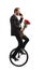 Businessman talking on a phone, riding a unicycle and carrying a bunch of red roses