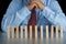 Businessman thinking behind the wood block in row, metaphor to b