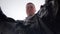 Businessman throws crumpled plastic bottles into the trash. View from inside the basket.