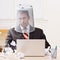 Businessman with trash basket on head