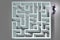 The businessman is trying to escape from maze labyrinth