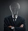 Businessman with Turned Off Light Bulb Head Concept. Brilliant Idea Concept