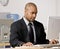 Businessman typing on computer at desk