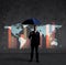 Businessman with umbrella standing over column diagram background. Business, crisis, default concept.