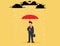 Businessman with umbrella in storm. Overcoming adversity Concept