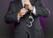 Businessman unlocking handcuffs