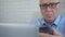 Businessman Using Laptop and Cellphone in Office Room, Businessperson Managing Company Information