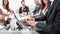 Businessman using laptop during a meeting of the Board of Directors