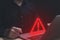 Businessman using laptop showing warning triangle and exclamation sign icon Warning of dangerous problems Server error. Virus.