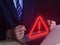 Businessman using laptop showing warning triangle and exclamation sign icon Warning of dangerous problems Server error. Virus.