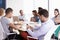 Businessman Using Mobile Phone In Boardroom Meeting